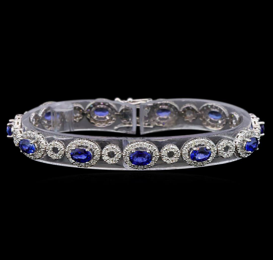 14KT White Gold 6.50 ctw Sapphire and Diamond Bracelet: One electronically tested 14KT white gold ladies cast blue sapphire and diamond bracelet with a hidden box clasp with safety closer with a bright polish finish. Measurements: 6.75" in length Identifie
