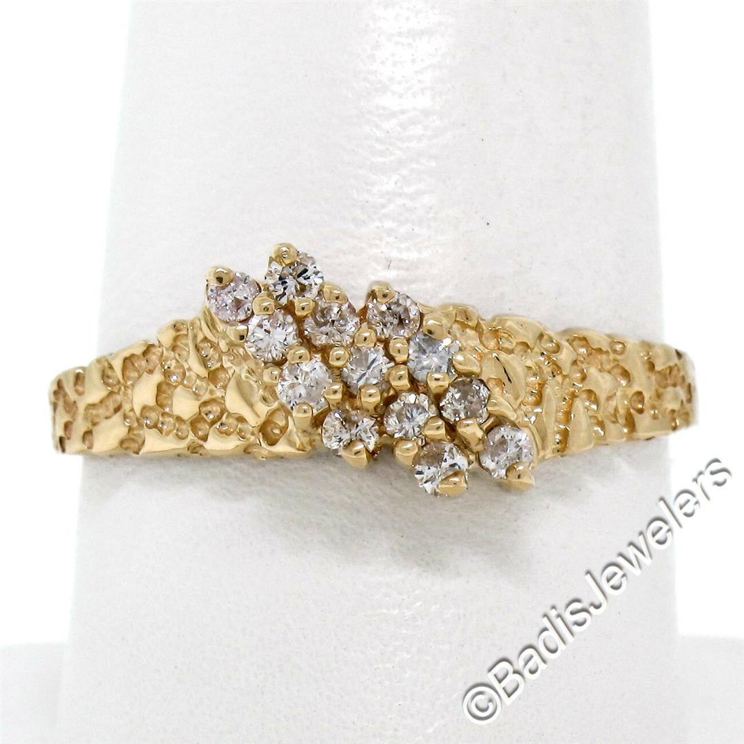 14kt Yellow Gold 0.30 ctw Round Brilliant Diamond: A 14kt yellow gold 0.30ctw round diamond (G/H - VS2/SI1) band ring with a nugget texture. The ring is size 10.0, weighs a total of 2.86 grams, and measures 7.85mm wide.