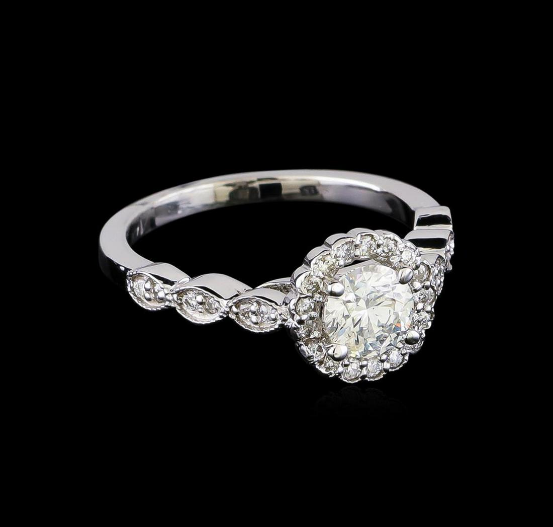 0.92 ctw Diamond Ring - 14KT White Gold: One electronically tested 14KT white gold lady's cast wedding ring with a scalloped shank halo with a bright polish with milgrain detailing finish. The featured lady's ring has a shank measuring 1.83