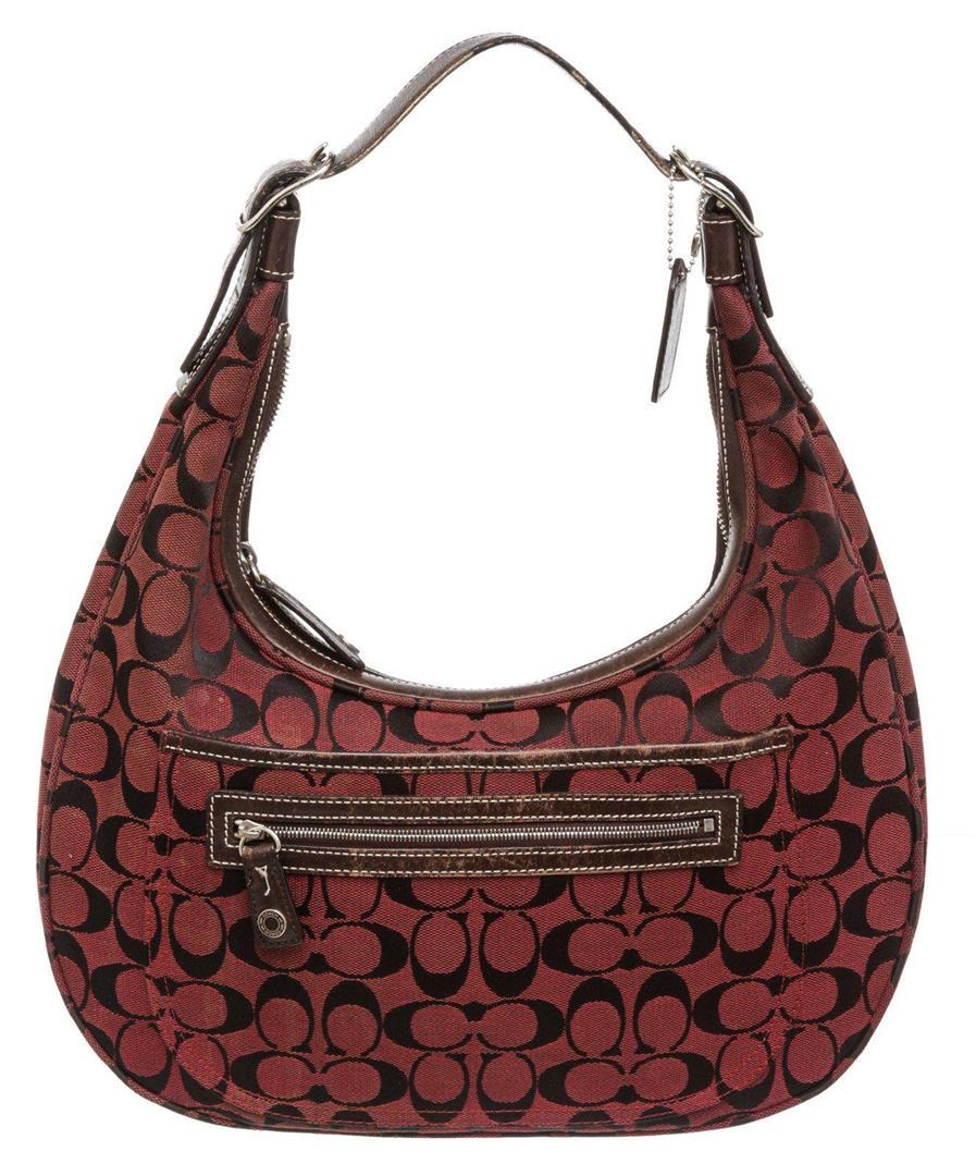 Coach Burgundy Monogram Canvas Brown Leather Shoulder: Coach burgundy black monogram canvas shoulder bag with dark brown leather trim, silver-tone hardware, brown canvas lining, interior zip pocket, front exterior snap pocket and front exterior zip pocket