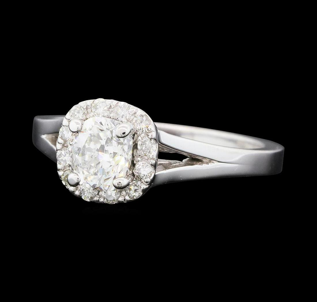 0.93 ctw Diamond Ring - 14KT White Gold: One electronically tested 14KT white gold lady's cast wedding ring with a split shank basket halo with a bright polish finish. The featured lady's ring has a shank measuring 2.18 millimeters wide. Ide