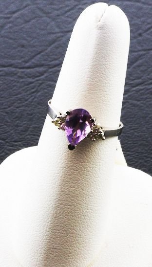 Ladies Diamond & Amethyst Ring.26cts FJ21: Ladies Diamond & Amethyst Ring.26cts FJ21 - As-Is Condition FJ CS899W - Thank you for viewing this auction. We appreciate your business. Check out our future auctions from Seized Assets Auctioneers.
