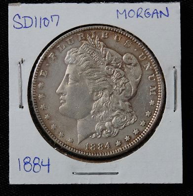 1884 Morgan Silver Dollar SD1107: 1884 Morgan Silver Dollar SD1107 - AE817D - Thank you for bidding on this item. We appreciate your business. Be sure to check out all of the upcoming auctions offered by Seized Assets Auctioneers!
