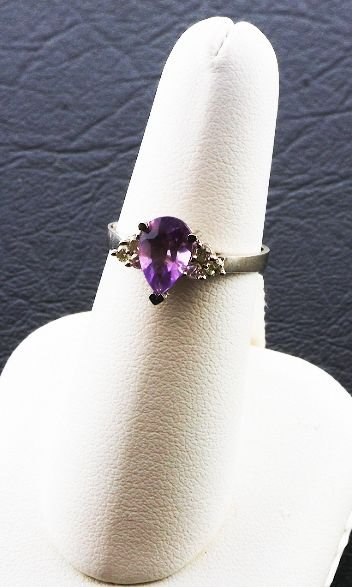 Ladies Diamond & Amethyst Ring.26cts FJ20: Ladies Diamond & Amethyst Ring.26cts FJ20 - As-Is Condition FJ CS899W - Thank you for viewing this auction. We appreciate your business. Check out our future auctions from Seized Assets Auctioneers.
