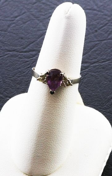 Ladies Diamond & Amethyst Ring.26cts FJ22: Ladies Diamond & Amethyst Ring.26cts FJ22 - As-Is Condition FJ CS899W - Thank you for viewing this auction. We appreciate your business. Check out our future auctions from Seized Assets Auctioneers.