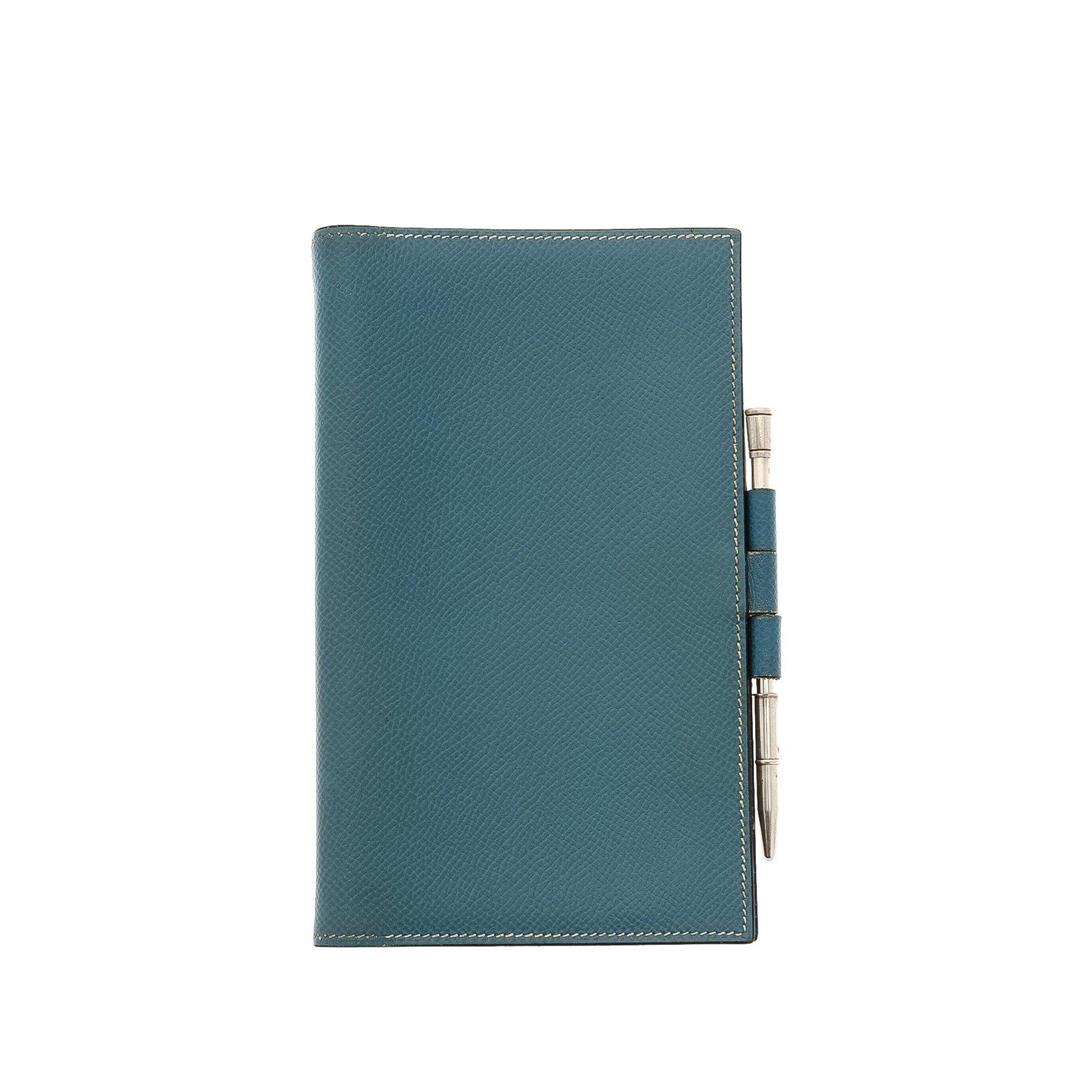 Hermes Jeans Leather Agenda Cover Wallet: Hermes Jeans Leather Agenda Cover Wallet with silver-tone hardware, leather Hermès Vision agenda cover with interior slit pockets, at interior, and snap closure. Measurements: Length: 0.25 in / 1 cm 