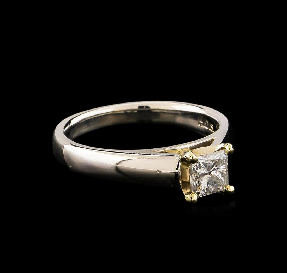 Platinum 0.70 ctw Diamond Ring: One electronically tested platinum ladies cast & assembled diamond solitaire ring. Condition is new, good workmanship. The featured diamond is set within a yellow gold basket supported by tapering sho