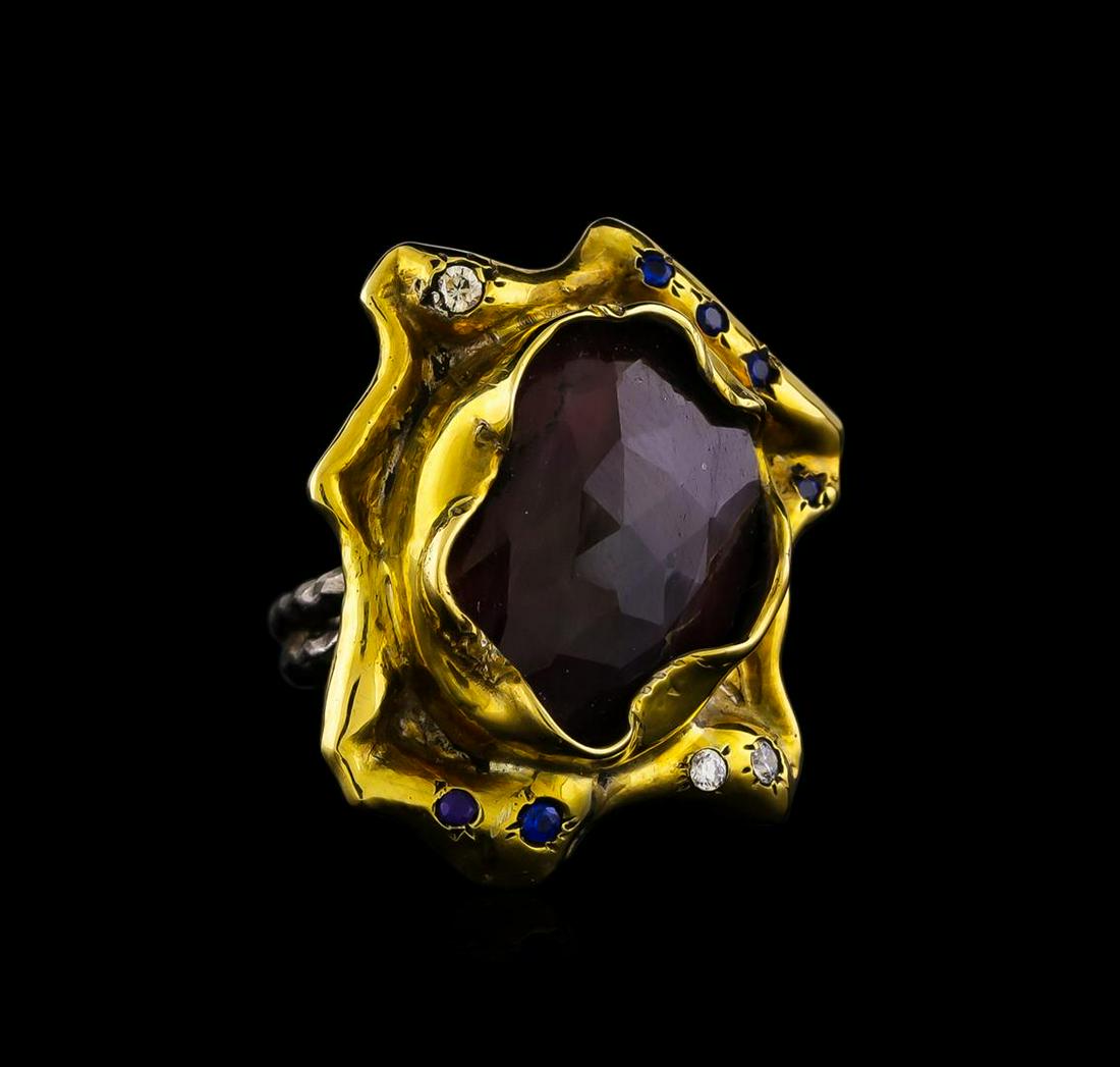 Sterling Silver Ring: One of a kind high fashion sterling silver Ring weighing 14.9 grams. Black Antique texture. Containing: Ruby, White Crystal, Blue Crystal. This sterling silver promises a lasting shine.