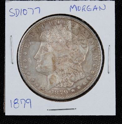 1879 Morgan Silver Dollar SD1077: 1879 Morgan Silver Dollar SD1077 - AE817D - Thank you for bidding on this item. We appreciate your business. Be sure to check out all of the upcoming auctions offered by Seized Assets Auctioneers!