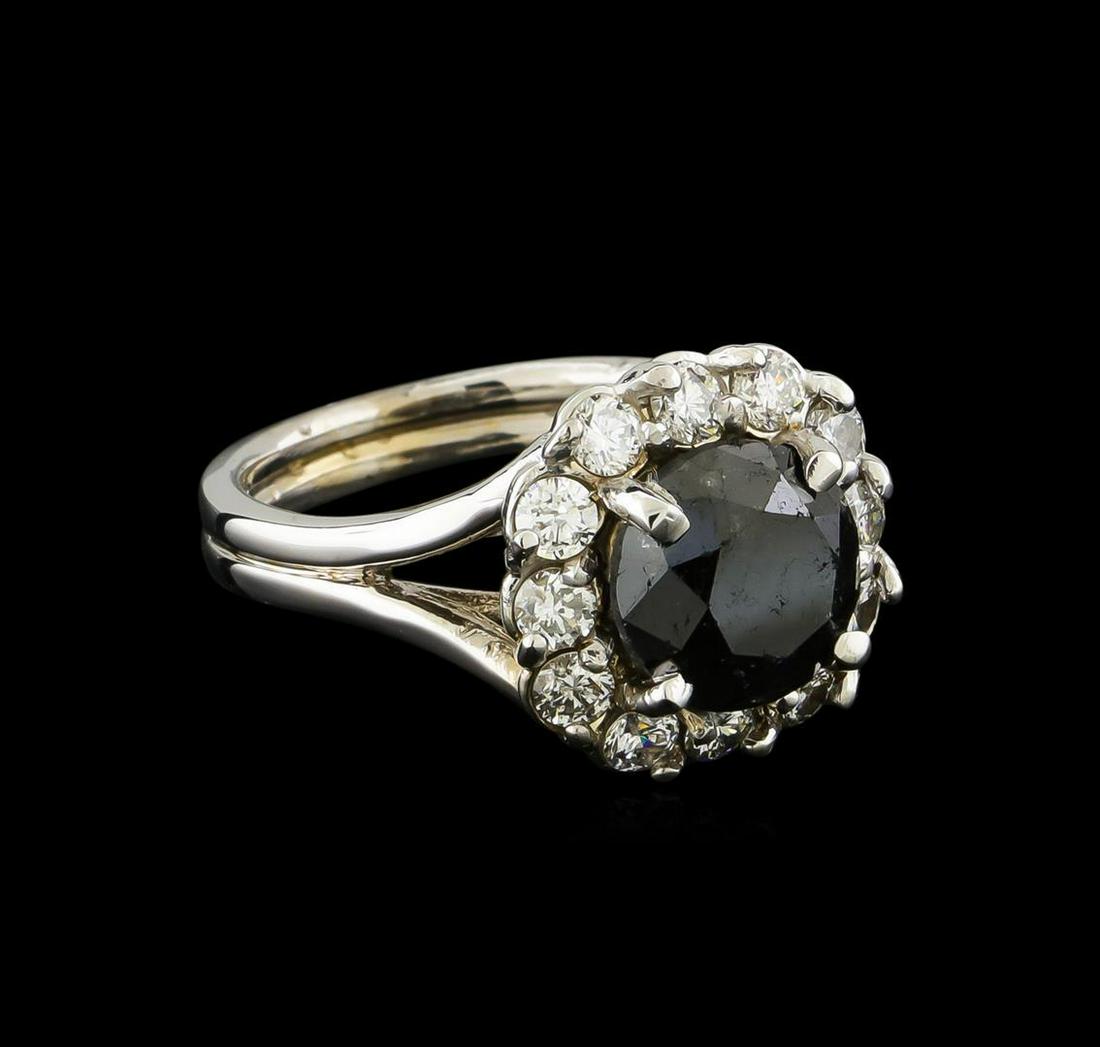 4.42 ctw Black Diamond Ring - 14KT White Gold: One electronically tested 14KT white gold lady's cast fashion ring with a split shank basket halo with a bright polish finish. The featured lady's ring has a double shank measuring 3.20 millimeters wi