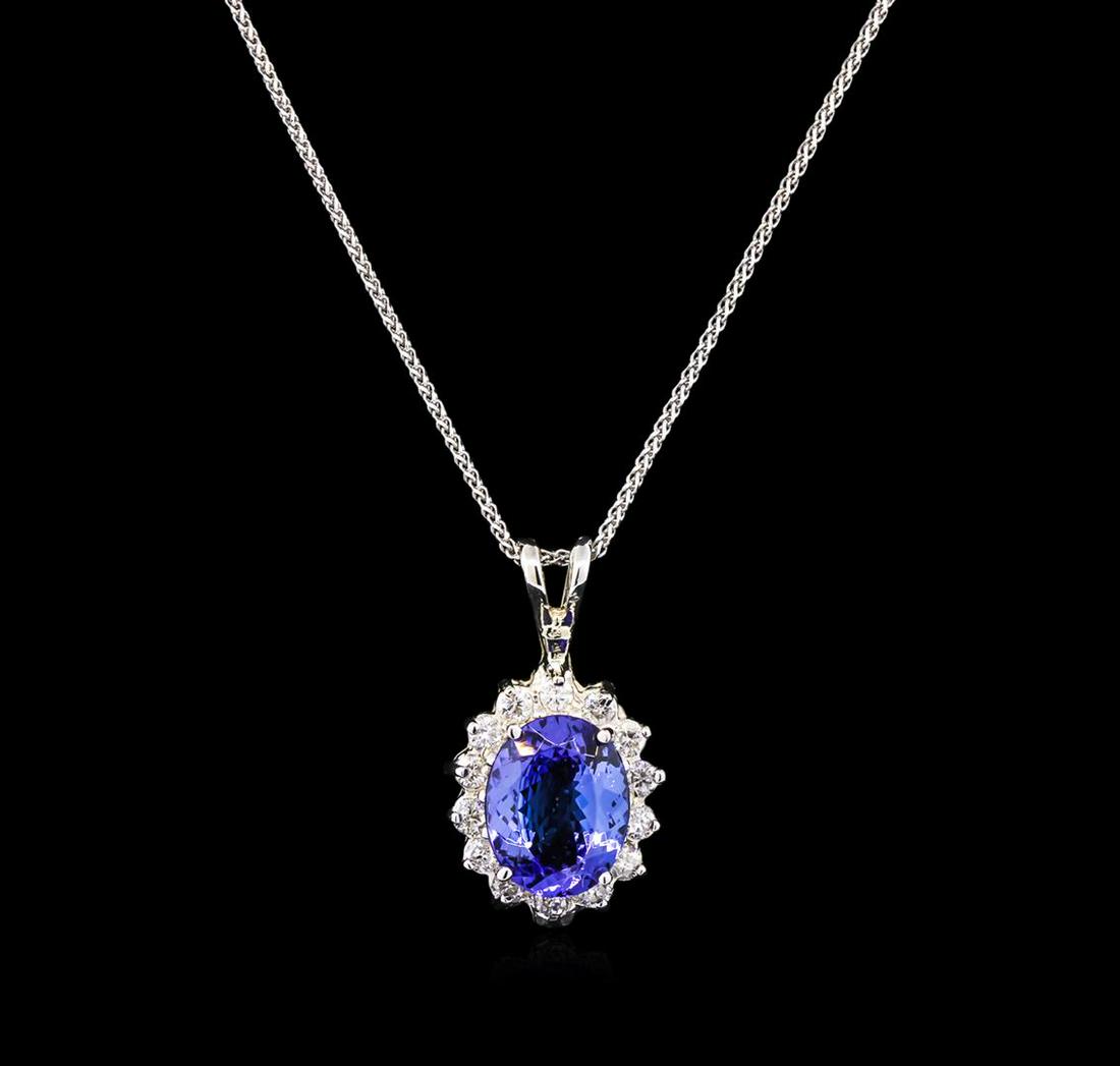 3.00 ctw Tanzanite and Diamond Pendant With Chain -: One electronically tested 14KT white gold lady's cast fashion pendant & chain 18.0" long, 1mm diamond cut wheat link with a lobster claw clasp with a halo with a bright polish finish. Identified with 