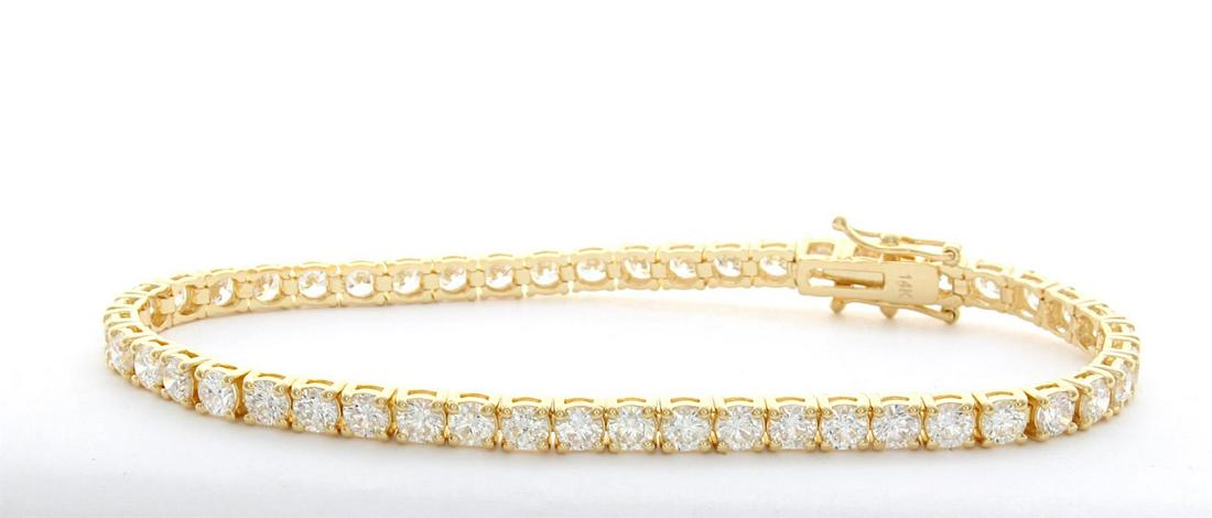 7.0 ctw Diamond Tennis Bracelet: 14K Yellow Gold Ladies 7 Carat Diamond Tennis Bracelet. Diamond Quality is G-H Color SI1-SI2 In Clarity