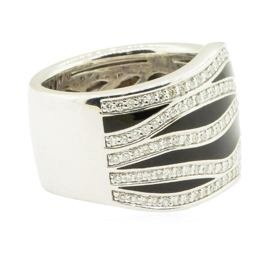 0.86 ctw Diamond Ring - 18KT White Gold: One electronically tested 18KT white gold lady's cast fashion designer ring with a wide band wave motif with a bright polish finish. The featured lady's ring has seven unique sections of shiny black e