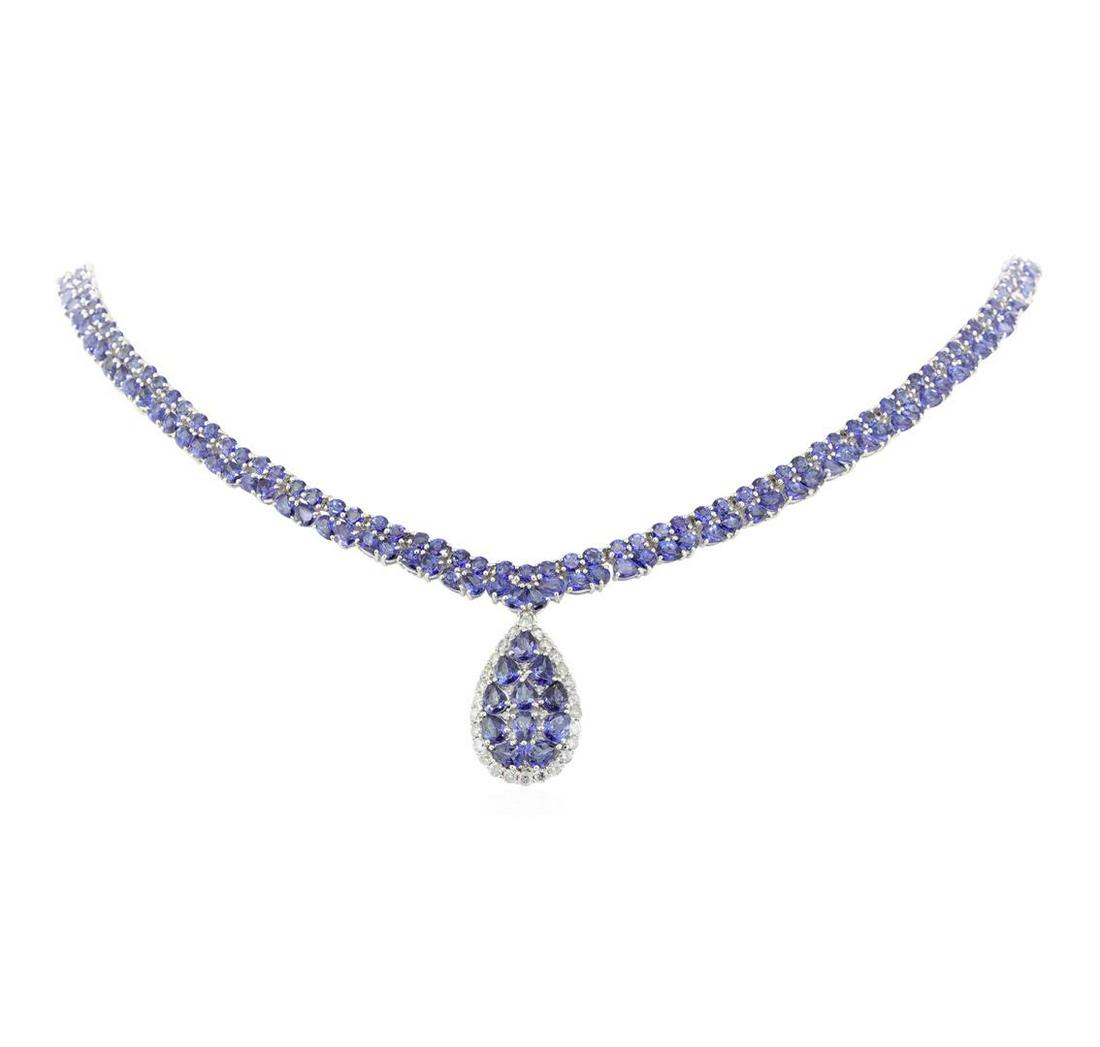 34.55 ctw Tanzanite and Diamond Necklace - 14KT White: One electronically tested 14KT white gold ladies cast & assembled tanzanite and diamond necklace with a bright polish finish. Seventeen and one-half inch length necklace features a tanzanite and diamo
