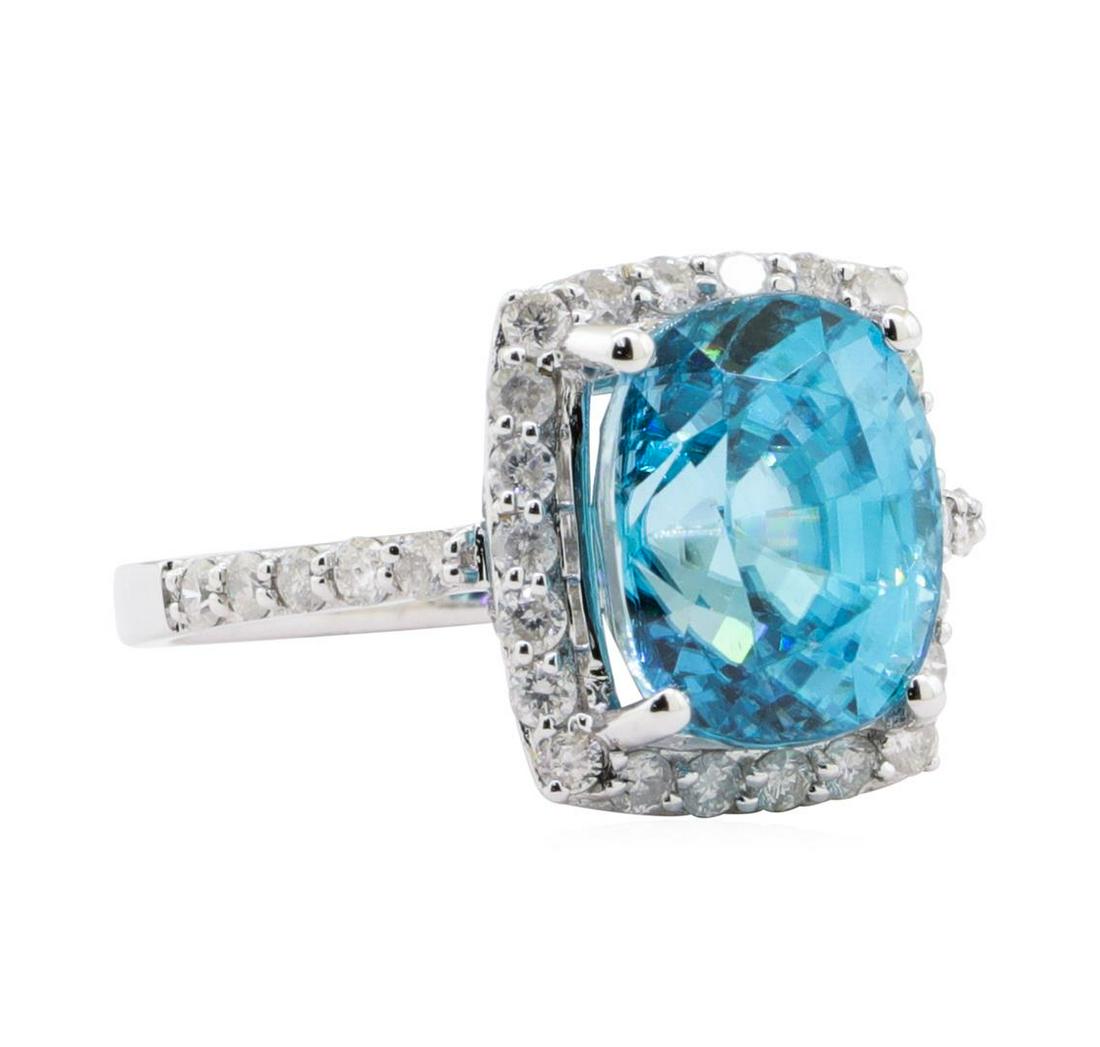 8.07 ctw Blue Zircon and Diamond Ring - 14KT White Gold: One polished, stamped, and tested 14 karat white gold ling with a bright ?nish. The ring is mounted with: I genuine blue zircon center stone weighing approximately 8.07 carat, and 32 genuine round dia