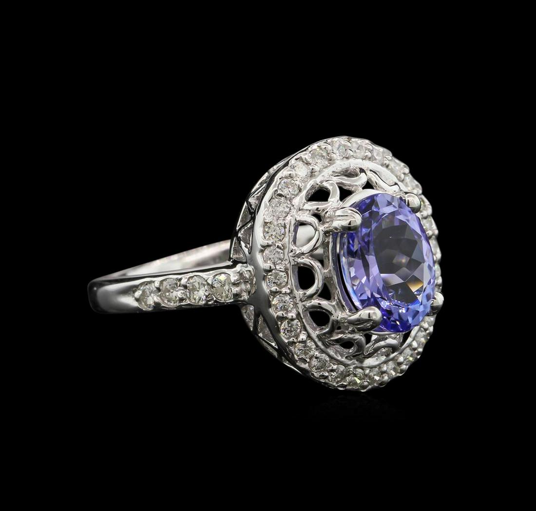 2.10 ctw Tanzanite and Diamond Ring - 14KT White Gold: One ring featuring: 14KT white gold weighing 5.15 grams containing one tanzanite center stone with a total weight of 2.10 ct and 48 diamonds with a total weight of 0.42ct.