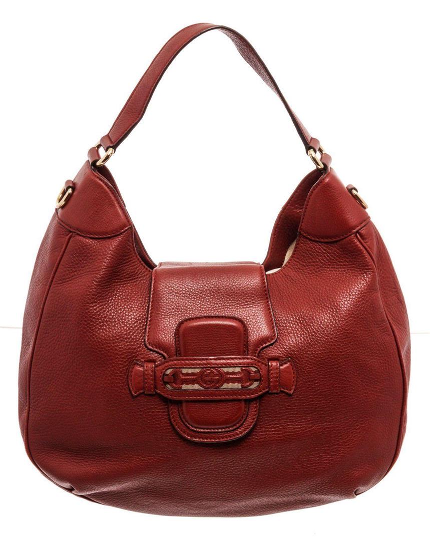 Gucci Red Leather Shoulder Bag: Gucci Red Leather Shoulder Bag. Gucci Red Leather Shoulder Bag with material Leather gold-tone hardware, interior slip pockets, shoulder strap and snap closure. MEASUREMENTS: Length 1 in / 3 cm Width