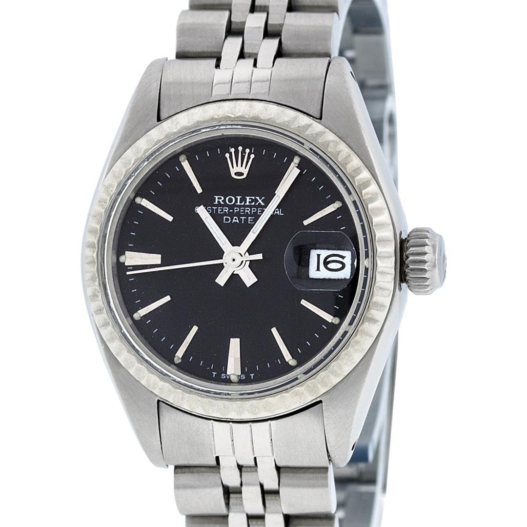Rolex Ladies Stainless Steel Black Index Dial 26MM: One Ladies Stainless Steel Rolex Datejust Polished Bright with Satin Finish, Serviced & Electronically Tested, Stainless Steel Case: 26mm, Stainless Steel Crown, Bezel: 14K White Gold Fluted Bezel. Cu