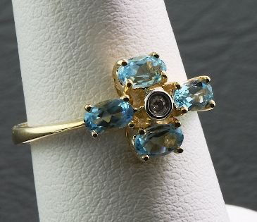 14KT Gold Diamond & Blue Topaz Ring FJ132: 14KT Gold Diamond & Blue Topaz Ring FJ132 - Great Condition - CM084R - 1.15cts Blue Topaz & .02 Diamonds - Thank you for viewing this lot. We have many great items for sale. Please check our future au