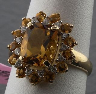 10KT Gold .20ct Diamond & 4.00 Citrine Ring FJ138: 10KT Gold .20ct Diamond & 4.00 Citrine Ring FJ138 - Great Color - NB131GT - Excellent Condtion. Citrine - 4.00cts - Thank you for viewing this lot. We have many great items for sale. Please check our