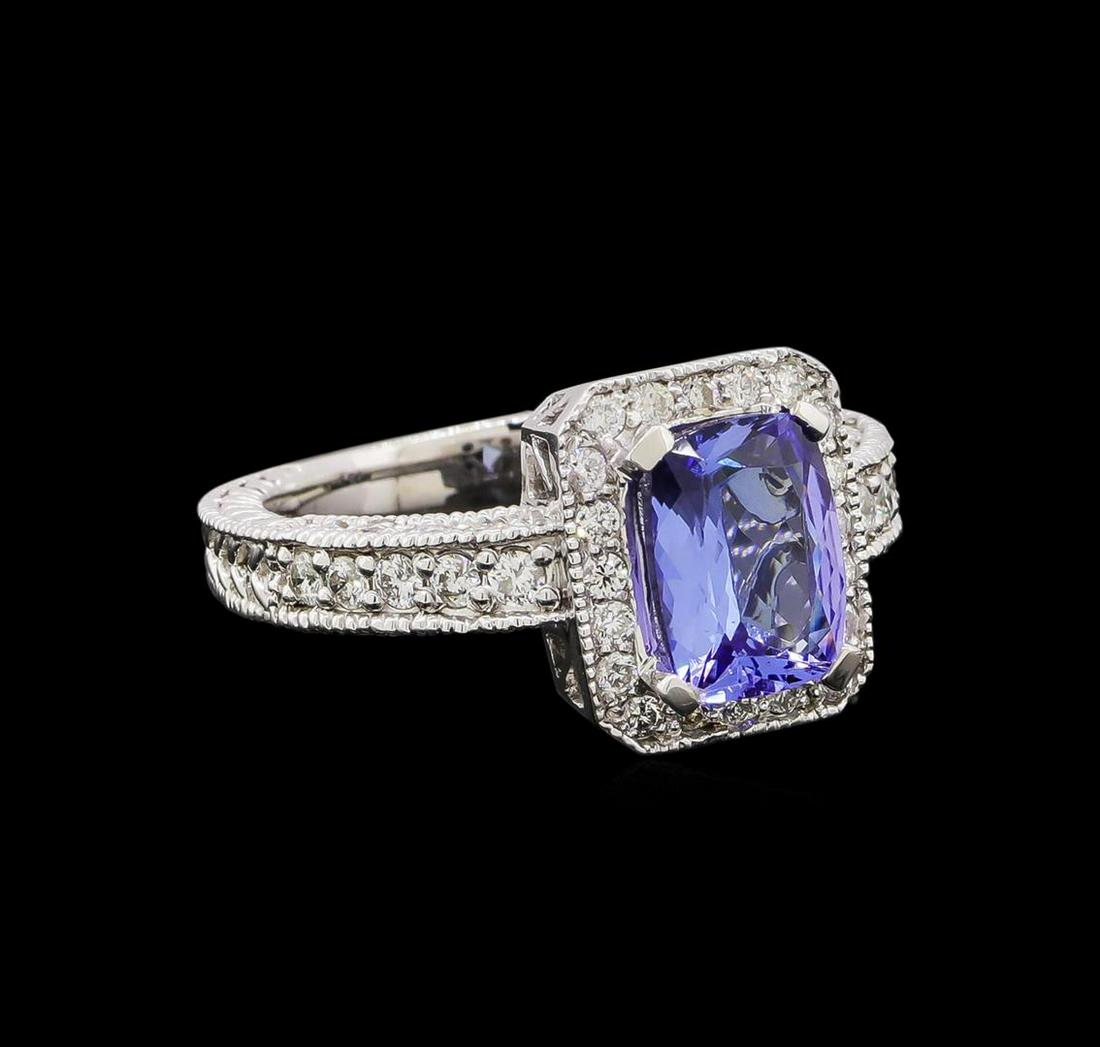 14KT White Gold 1.54 ctw Tanzanite and Diamond Ring: One electronically tested 14KT white gold ladies combination cast & assembled tanzanite and diamond ring with a bright polish finish. Identified with markings of "14K". Condition is new. Containing: O