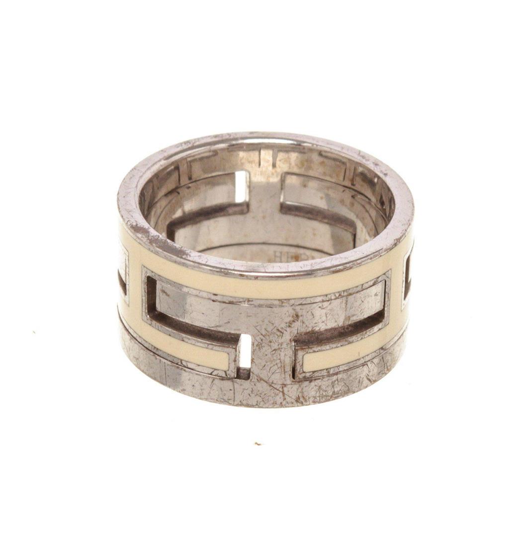 Hermes Silver Moveable H Ring: Hermes Silver Moveable H Ring. Hermes Silver Moveable H Ring with gold-tone hardware.