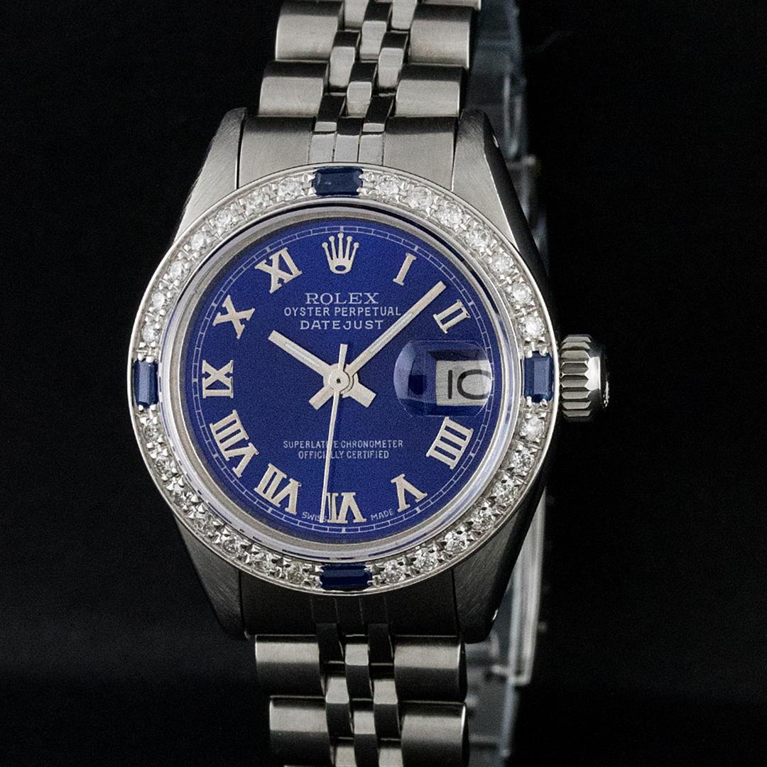 Rolex Ladies Stainless Steel Blue Diamond & Sapphire 26: One Ladies Stainless Steel Rolex Datejust Polished Bright with Satin Finish, Serviced & Electronically Tested, Stainless Steel Case: 26mm, Stainless Steel Crown, Custom Bezel: New 18K White Gold Sapph