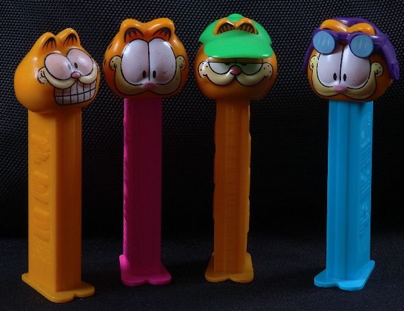 Garfield #20 - Lot of (4) Vintage Pez Dispensers: Garfield #20 - Lot of (4) Vintage Pez Dispensers - Excellent Used Condtion. Good paint, no cracks, working condition. - Thank you for bidding on this lot. We appreciate your business. Be sure to check