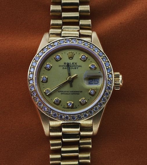 Ladies 18KT Rolex DateJust Watch W32: Ladies 18KT Rolex DateJust Watch W32. Many of our items have been professionally appraised by an actual gemologist. This item is valued at $22,100. Great Condition - 1.00 ct diamonds, 66.20 gm, Full A