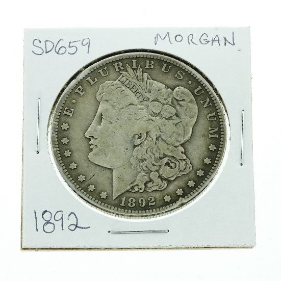 1892 Morgan Silver Dollar SD659: 1892 Morgan Silver Dollar SD659 - Good - As-Is Condition. Coin #A57195 - Thank you for viewing this auction. We appreciate your business. Check out our future auctions from Seized Assets Auctioneers.