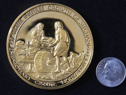 "Inventing The Wheel" #3 24Kt Gold Plated Sterlin: Inventing The Wheel" #3 24Kt Gold Plated Sterling Silver Medal - This is a rare Franklin Mint "History of Mankind" 24kt. Gold Plated over Sterling Silver Medal. Coin weights 1.985 Troy Oz. (Nearly 2 f