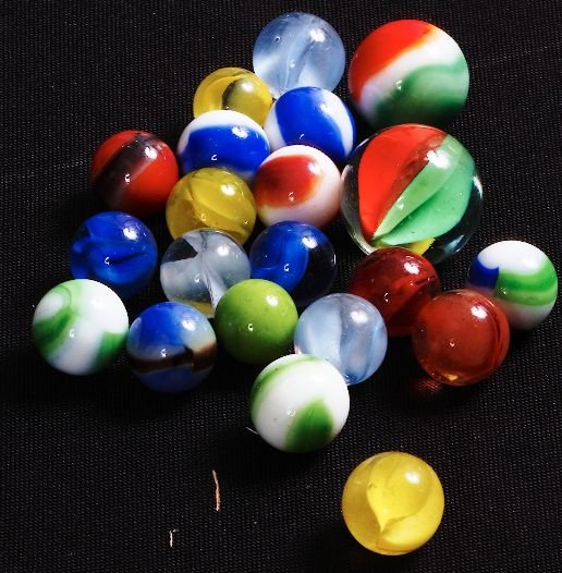 Vintage Glass Marbles (25) w/ Large Shooter Lot #: Vintage Glass Marbles (25) w/ Large Shooter Lot #8 - As-Is Condition Vintage Condtion of machine-made glass marbles. Assorted colors and sizes. - Thank you for viewing this auction. We appreciate your