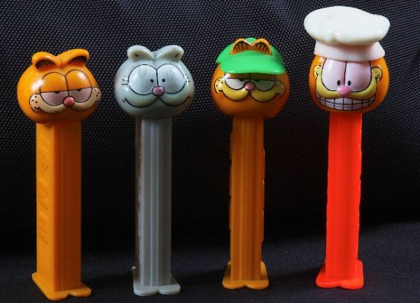 Garfield #4 - Lot of (4) Vintage Pez Dispensers: Garfield #4 - Lot of (4) Vintage Pez Dispensers - Excellent Used Condtion. Good paint, no cracks, working condition. - Thank you for bidding on this lot. We appreciate your business. Be sure to check
