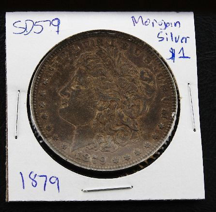 1879 Morgan Silver Dollar SH579: 1879 Morgan Silver Dollar SH579 - As-Is Condition - Thank you for viewing this auction. We appreciate your business. Check out our future auctions from Seized Assets Auctioneers.