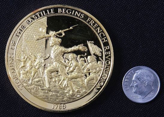 "Storming The Bastille" #64 24Kt Gold Plated Sterl: Storming The Bastille" #64 24Kt Gold Plated Sterling Silver Medal - This is a rare Franklin Mint "History of Mankind" 24kt. Gold Plated over Sterling Silver Medal. Coin weights 1.985 Troy Oz. (Nearly