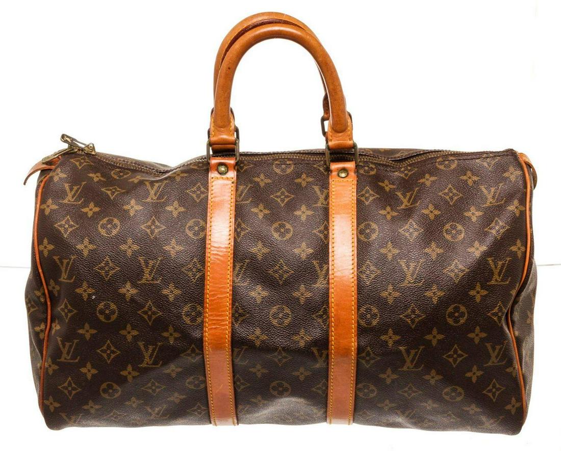 Louis Vuitton Brown Monogram Keepall 45cm Travel Bag: Louis Vuitton Brown Monogram Keepall 45cm Travel Bag. Louis Vuitton Brown Monogram Keepall 45cm Travel Bag with material monogram canvas, gold-tone hardware, interior zip pockets, dual top handles han