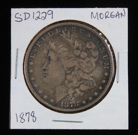 1878 Morgan Silver Dollar SD1229: 1878 Morgan Silver Dollar SD1229 - Good Vintage/Circulated Condition. AT71J8. - Thank you for viewing this auction. We appreciate your business. Check out our future auctions from Seized Assets Auctio