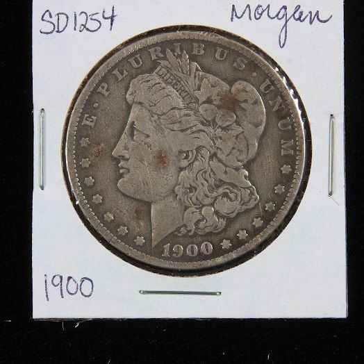 1900 Morgan Silver Dollar SD1254: 1900 Morgan Silver Dollar SD1254 - Good Vintage/Circulated Condition. AT71J8. - Thank you for viewing this auction. We appreciate your business. Check out our future auctions from Seized Assets Auctio