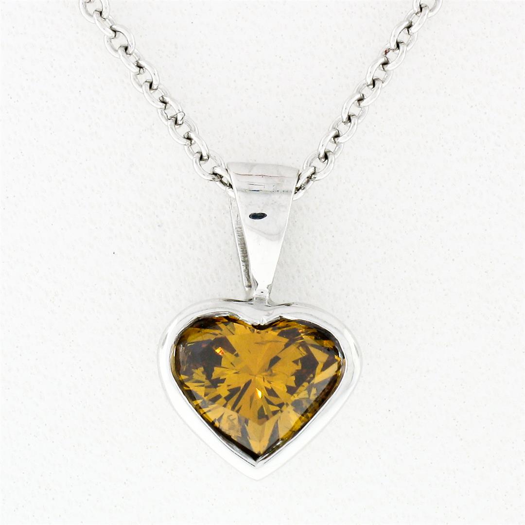 14k White Gold GIA 0.70 ctw Fancy Deep Brown Orange: 14k White Gold GIA 0.70ct Fancy Deep Brown Orange Heart Natural Diamond Pendant. A solid 14k white gold pendant featuring a GIA certified heart brilliant cut natural diamond (Fancy Deep Brown-Orange -