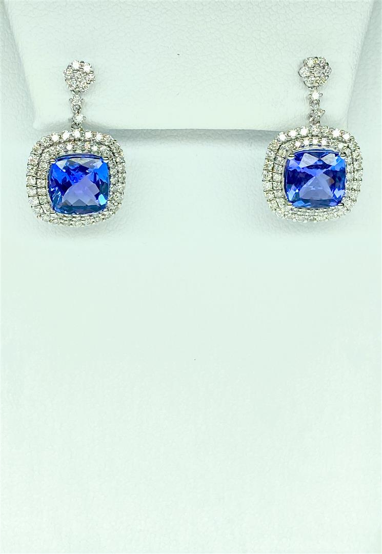 18KT White Gold 5.95 ctw Tanzanite and Diamond Earrings: One pair Cushion cut Tanzanite and Diamond Earrings in 18KT White Gold. 18KT - 5.70 grams. Tanzanite (cushion) - 4.86ct. Diamond - 1.09ct.