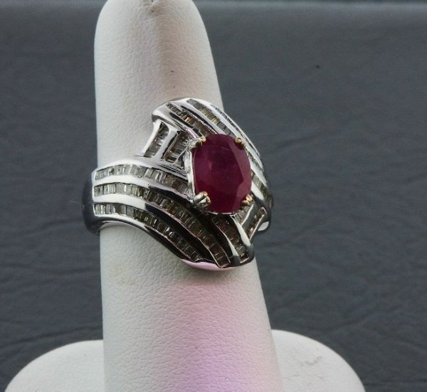 Ruby & Diamond Ring 9.71 grams A241 FULL APPRAISAL: Ruby & Diamond Ring 9.71 grams A241 FULL APPRAISAL - Excellent Condition. Ruby 2.77ct. & Diamond 1.81ct. Comes will FULL LETTER from AIG. See Scan. Valued at $6,865.00. - Thank you for viewing this lo