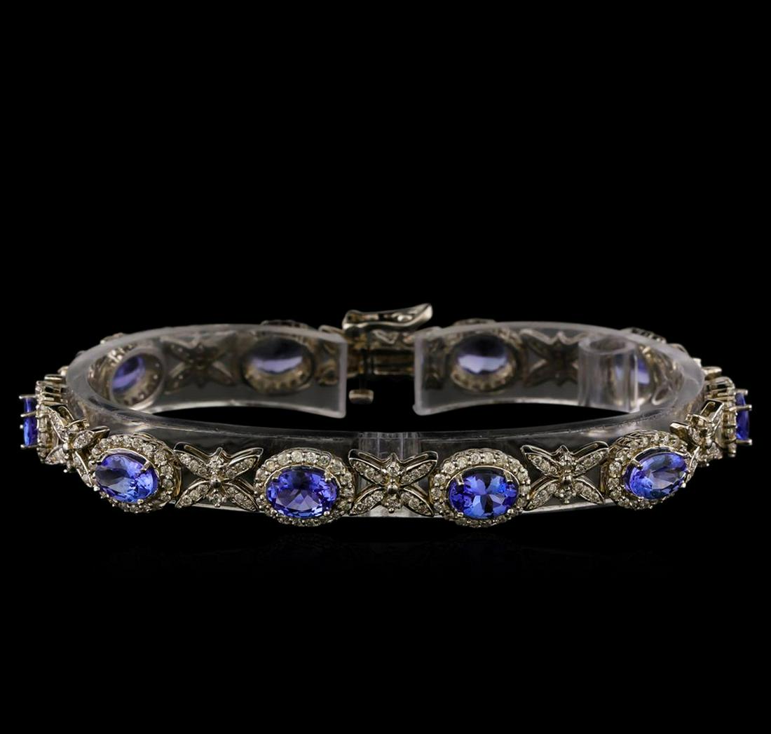 14KT White Gold 7.90 ctw Tanzanite and Diamond Bracelet: One electronically tested 14KT white gold ladies combination cast & assembled tanzanite and diamond bracelet with a bright polish finish. Measurements: 7.25" in length. Identified with markings of "14
