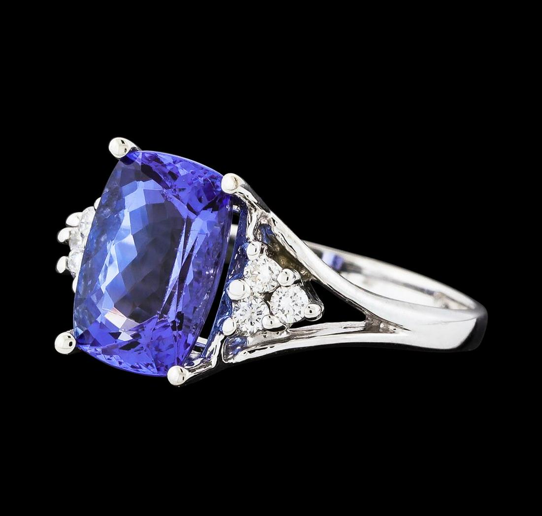 3.40 ctw Tanzanite and Diamond Ring - 14KT White Gold: One electronically tested 14KT white gold lady's cast fashion ring with a bright polish finish. The featured lady's ring has a shank measuring 1.84 millimeters wide. Identified with markings of '14K'.