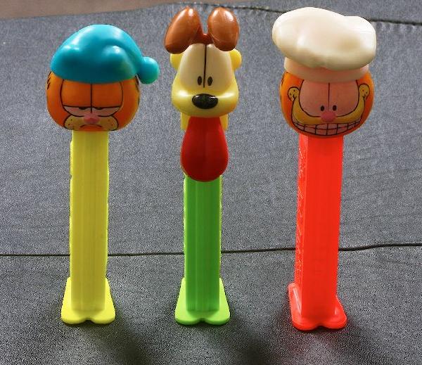 Garfield #35 - Lot of (3) Vintage Pez Dispensers: Garfield #35 - Lot of (3) Vintage Pez Dispensers - Excellent Vintage Used Condtion. Good paint, no cracks, working condition. - Thank you for viewing this lot. We are always adding new inventory and n