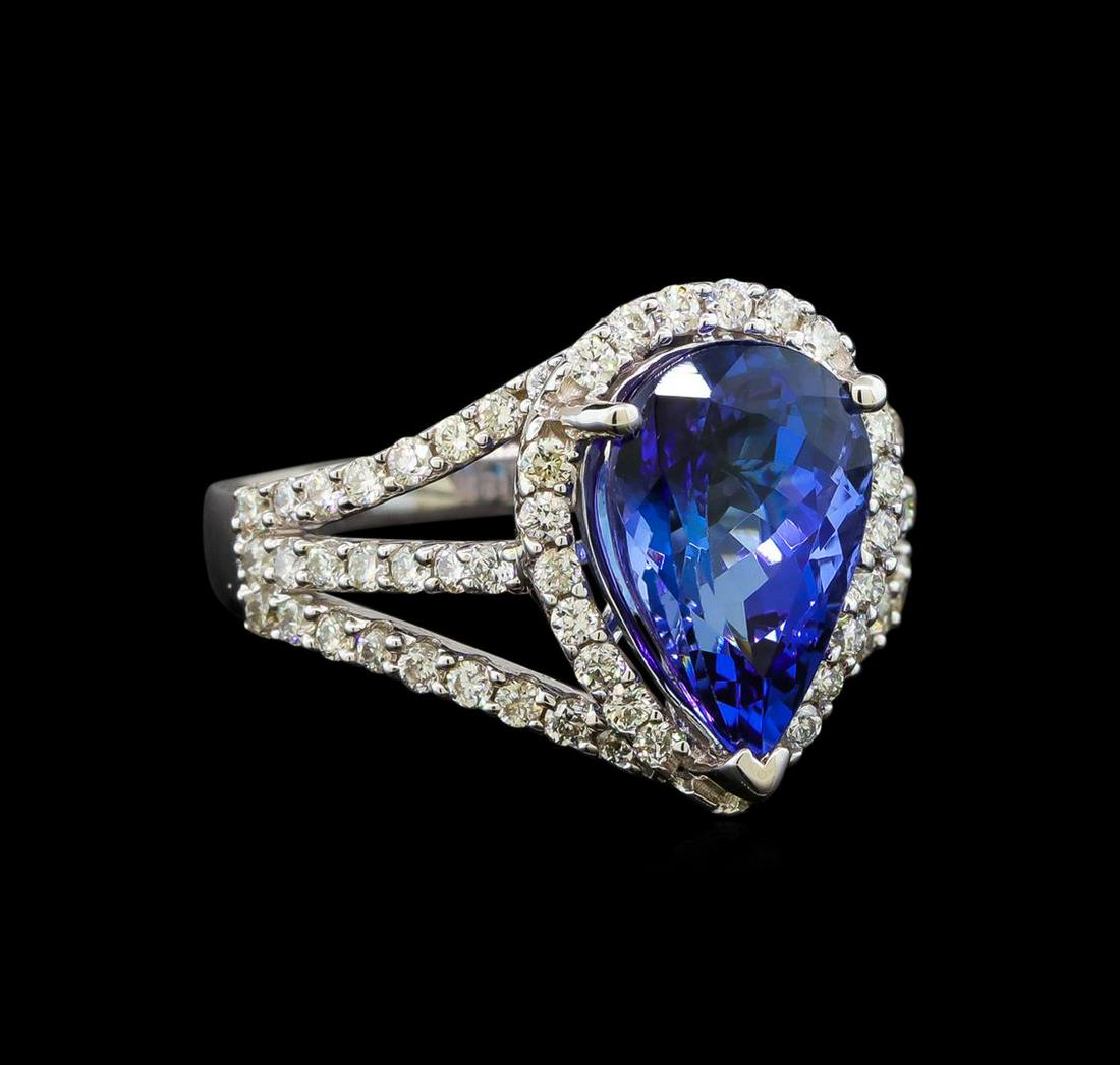 18KT White Gold 4.42 ctw Tanzanite and Diamond Ring: One electronically tested 18KT white gold ladies cast tanzanite and diamond ring with a split shank with a bright polish finish. Trademark is Orianne. Identified with markings of "14K". Condition is n