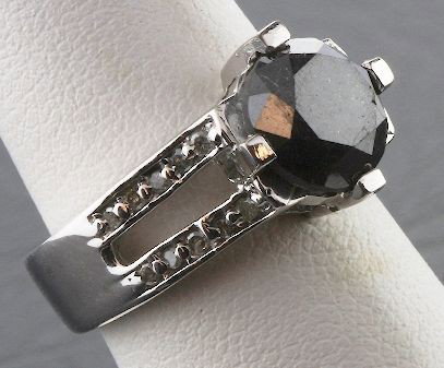 Black & White Diamond Ring 7.50 grams A398: Black & White Diamond Ring 7.50 grams A398 - Excellent Condition. Diamond 3.25ctw. Comes will FULL LETTER from AIG. See Scan. Valued at $6,800.00. - Thank you for viewing this lot. We are always addin