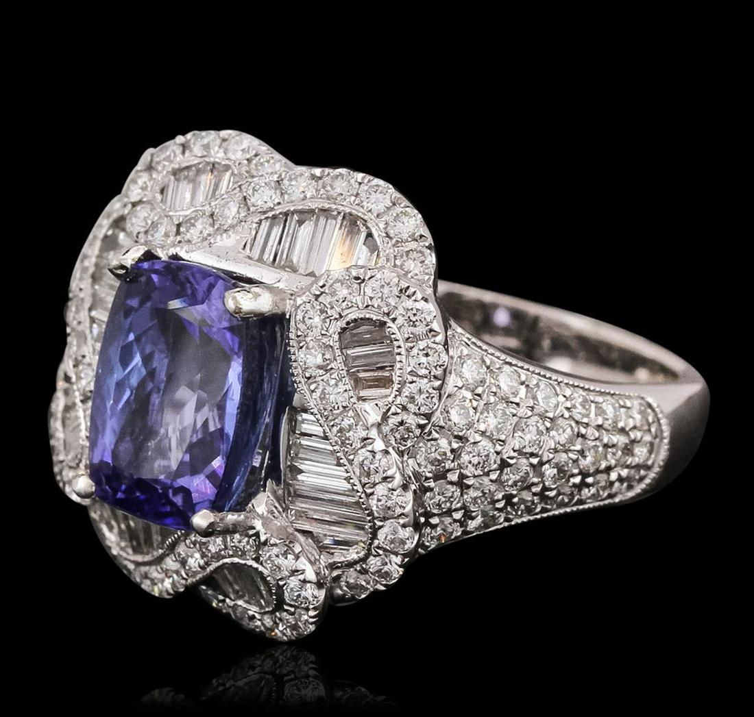 18KT White Gold 3.35 ctw Tanzanite and Diamond Ring: One electronically tested 18KT white gold ladies combination cast & assembled ring with a bright polish finish. Identified with markings of "750". Condition is new. Containing: One prong set rectangul