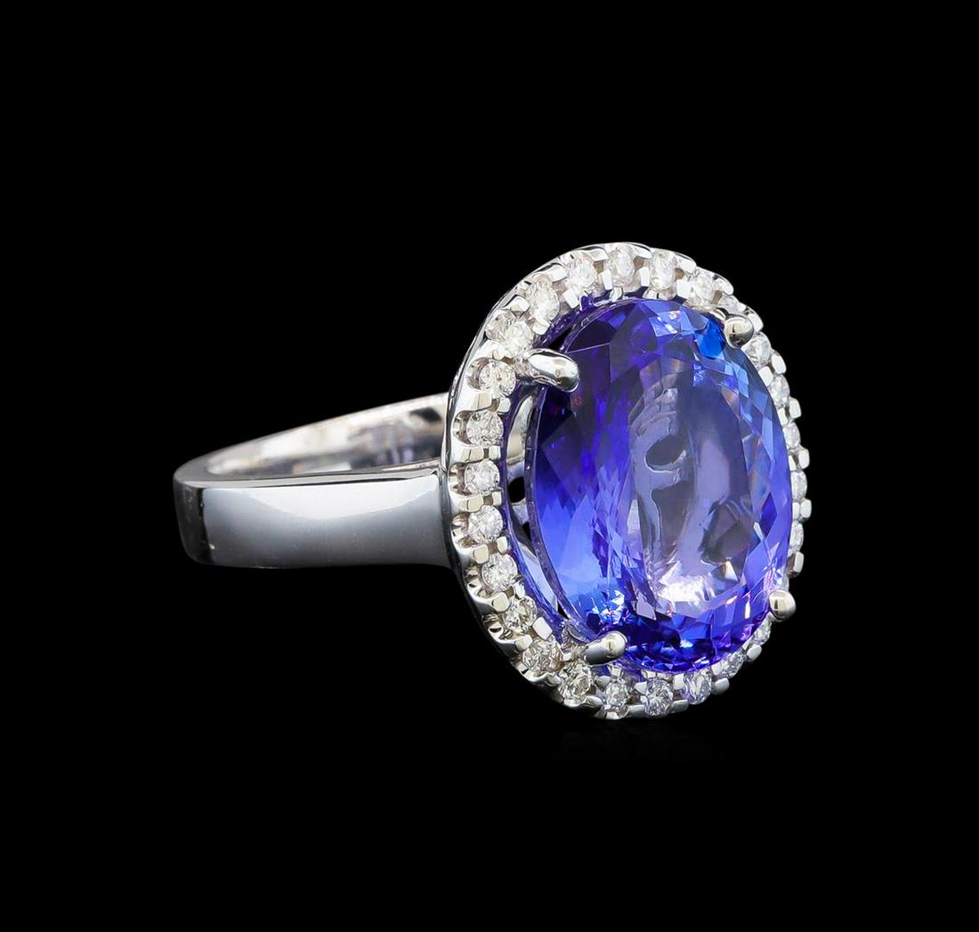 14KT White Gold 7.98 ctw Tanzanite and Diamond Ring: One electronically tested 14KT white gold ladies cast tanzanite and diamond ring with a bright polish finish. Identified with markings of "14K". Condition is new. Containing: One prong set oval modifi