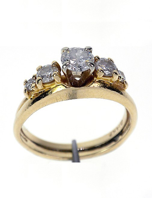 14KT Yellow Gold Ladies Diamond Wedding Set A660: 14KT Yellow Gold Ladies Diamond Wedding Set A660 Excellent Condition! One 14KT yellow gold ladies cast diamond wedding set. The wedding set includes a diamond engagement ring and a matching wedding ba