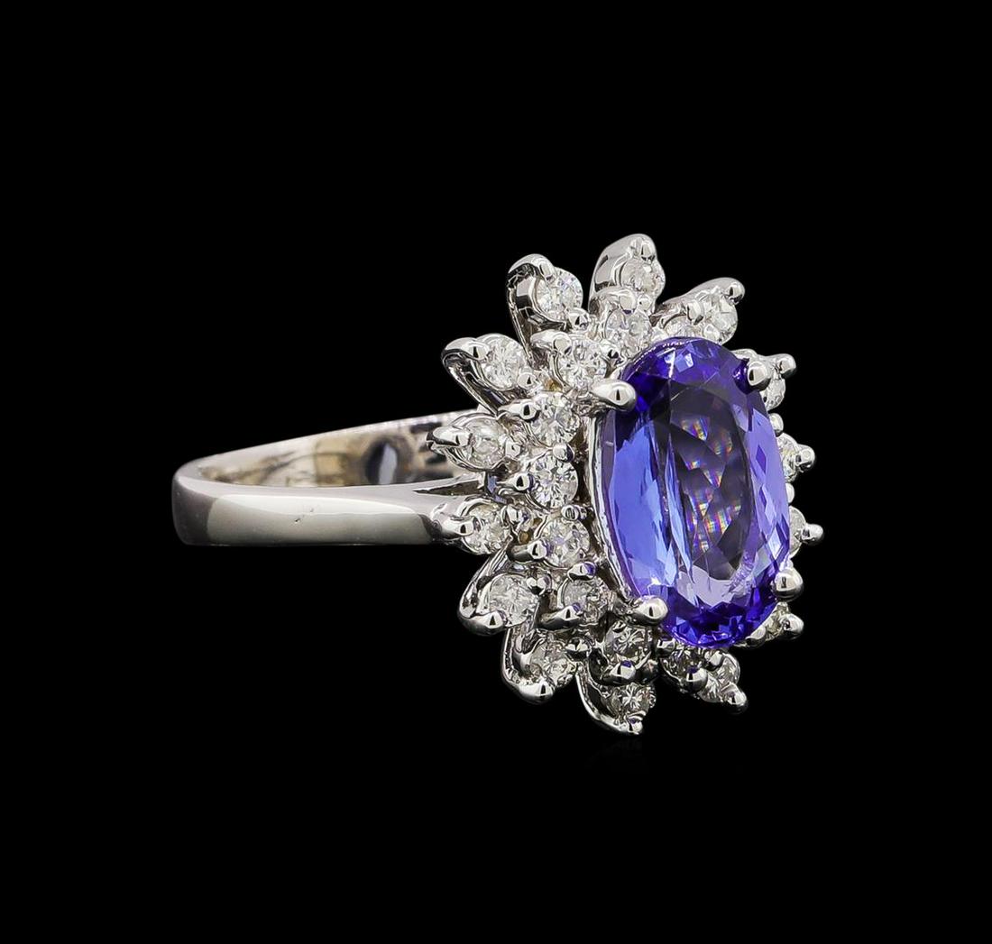 14KT White Gold 1.56 ctw Tanzanite and Diamond Ring: One electronically tested 14KT white gold ladies combination cast & assembled tanzanite and diamond ring with a bright polish finish. Identified with markings of "14K". Condition is new. Containing: O
